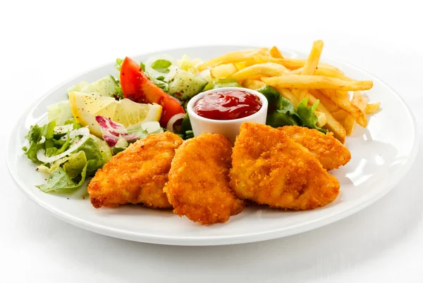 Grilled meat, french fries and vegetables — Stock Photo, Image