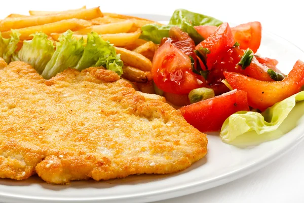 Pork chop, French fries and vegetables — Stock Photo, Image