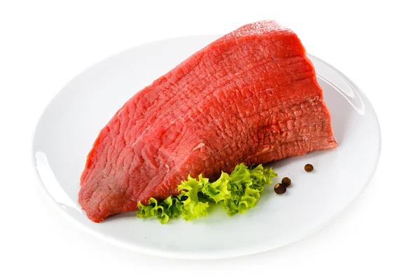 Raw beef on plate — Stock Photo, Image
