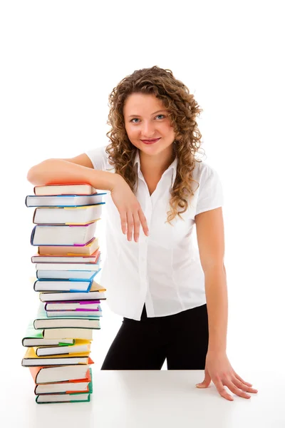 Mujer detrás de un montón de libros —  Fotos de Stock