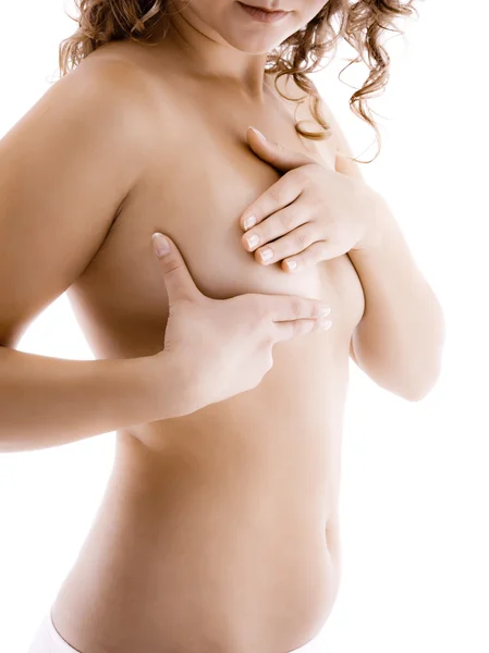 Mulher examinando seu peito — Fotografia de Stock