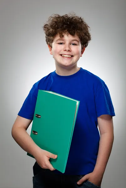 Young boy holding books — Stock Photo, Image