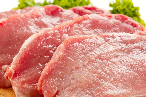 Carne de porco e produtos hortícolas crus — Fotografia de Stock