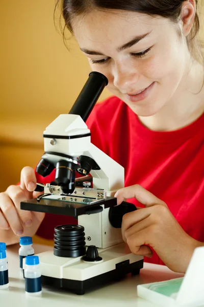Girl examining preparation — Stock Photo, Image