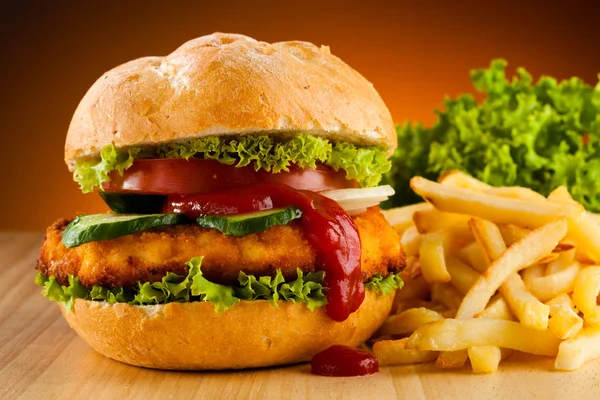 Big hamburger and French fries — Stock Photo, Image