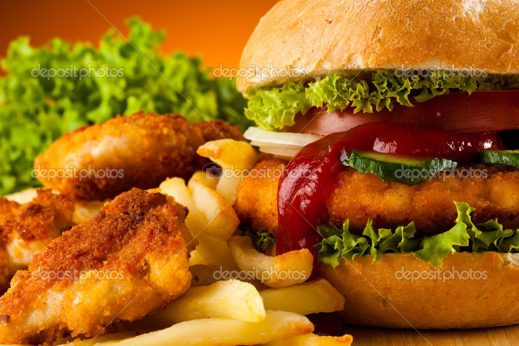 Big hamburger, chicken nuggets and French fries — Stock Photo © gbh007 ...