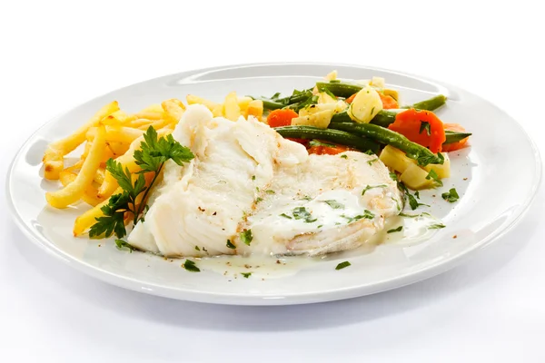 Fish dish - fish fillet in sauce and vegetables — Stock Photo, Image