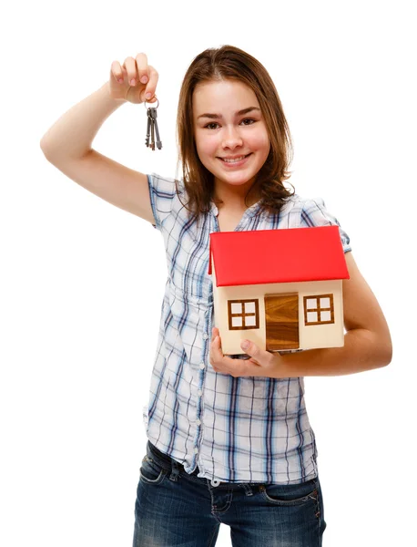 Menina com modelo de casa — Fotografia de Stock