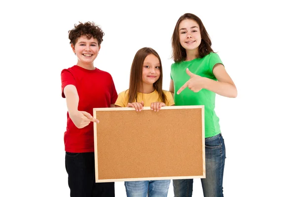 Kids with blank noticeboard — Stock Photo, Image