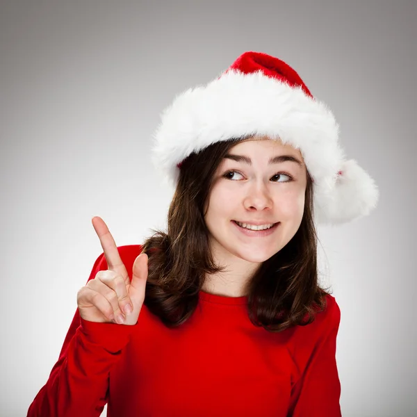 Красива дівчина в капелюсі Санта Клауса — стокове фото