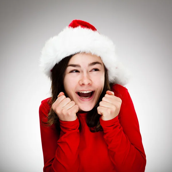 Menina bonita em chapéu de Papai Noel — Fotografia de Stock
