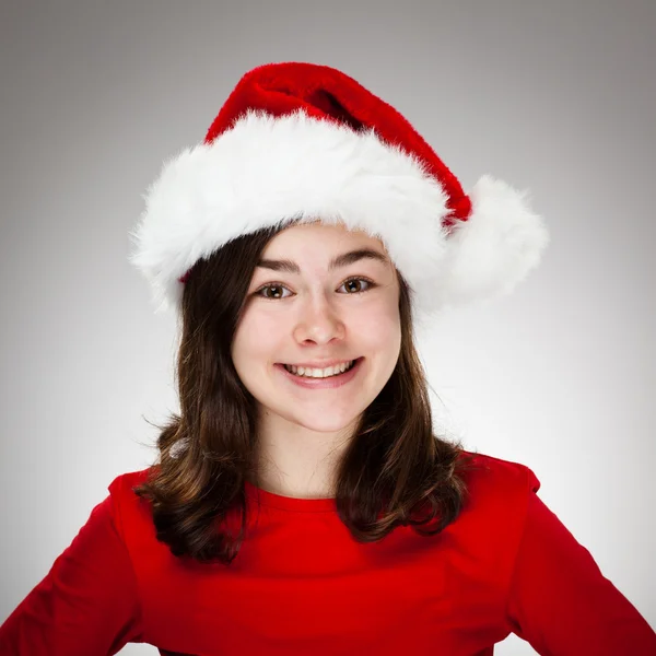 Menina bonita em chapéu de Papai Noel — Fotografia de Stock