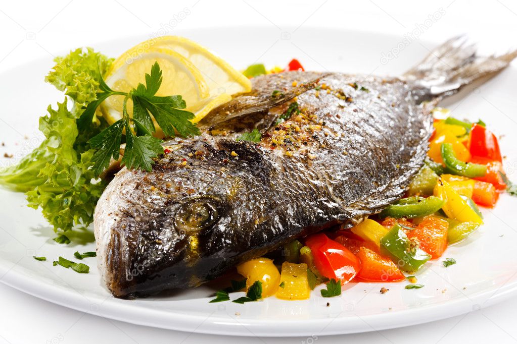 Fish dish roasted fish and vegetables — Stock Photo © gbh007 33471357