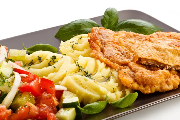 Pork chop, boiled potatoes and vegetables — Stock Photo, Image