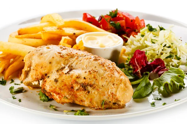 Fried chicken fillet, French fries and vegetables — Stock Photo, Image