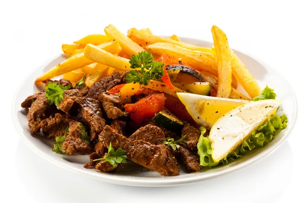 Roasted meat and French fries — Stock Photo, Image