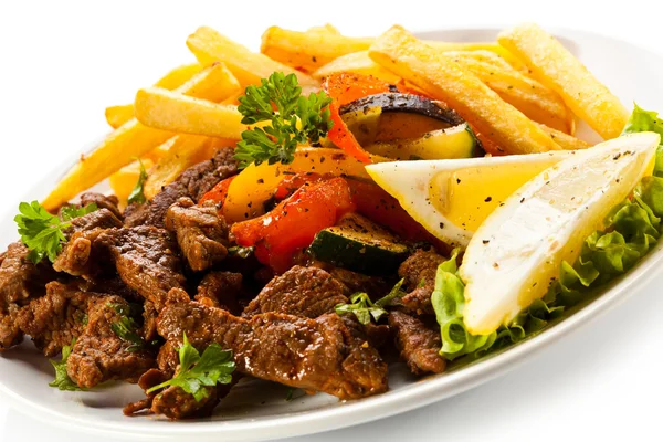 Roasted meat and French fries — Stock Photo, Image