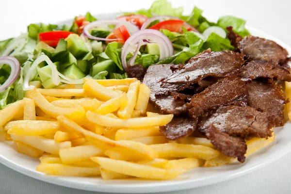 Grilled meat with fried potatoes — Stock Photo, Image