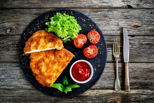 Breaded Fried Pork Chop Ketchup Fresh Vegetables Wooden Table — Stock Photo, Image