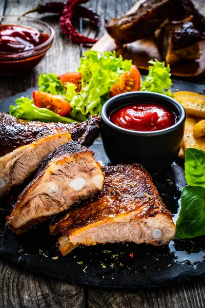 Tasty Grilled Ribs French Fries Fresh Vegetables Wooden Table — Stock Photo, Image