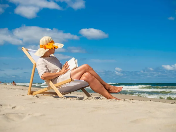 Woman Relaxing Beach Reading Book Sitting Sunbed Royalty Free Stock Photos