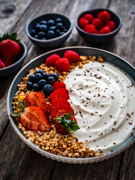 Yogurt Strawberries Blueberries Raspberries Muesli Bowl Wooden Table — Stock Photo, Image