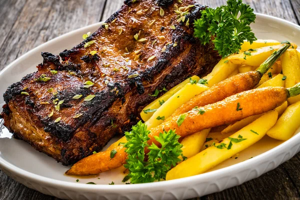 Tasty Grilled Ribs French Fries Caramelized Carrots Wooden Table — Stock Photo, Image