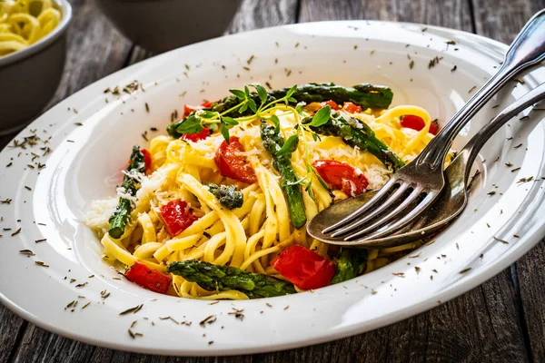 Pasta Asparagus Parmesan Tomatoes Wooden Table —  Fotos de Stock