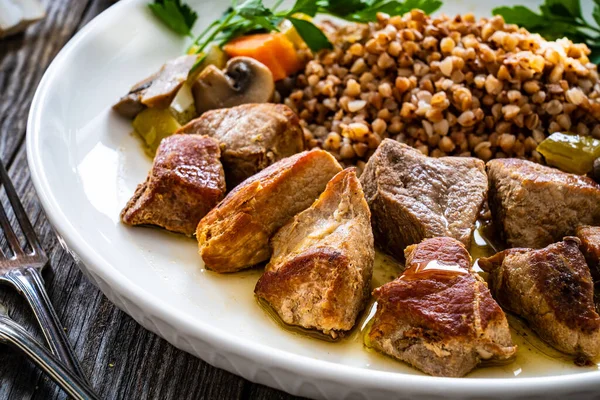 Roast Pork Buckwheat Groats Mushrooms Carrots Served Wooden Table — Stock fotografie