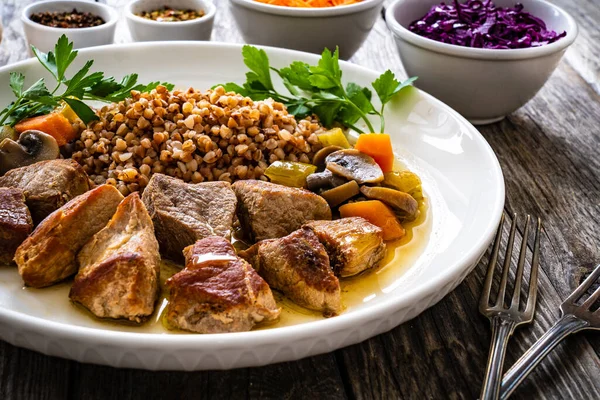 Roast Pork Buckwheat Groats Mushrooms Carrots Served Wooden Table — Stok fotoğraf