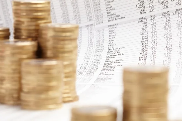 Newspaper and coins — Stock Photo, Image