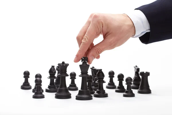 Business man moving chess figure — Stock Photo, Image