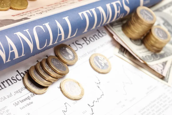 Financial newspaper with paper — Stock Photo, Image