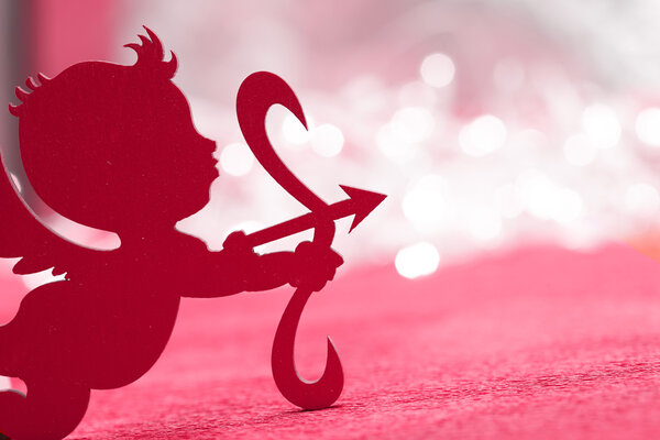 Cupid on red background