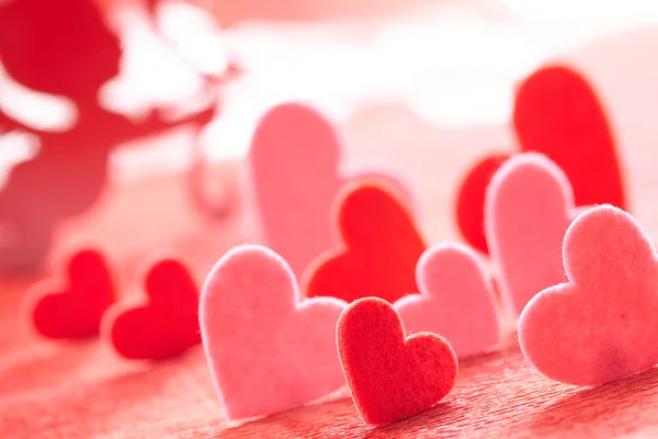 Hearts on red background — Stock Photo, Image