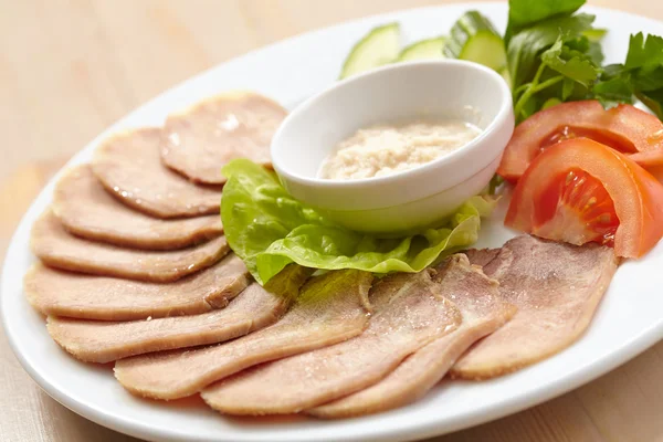 Slices of boiled beef tongue — Stock Photo, Image