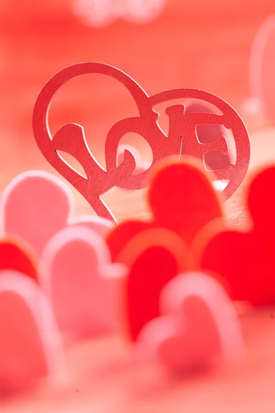 Hearts on red background — Stock Photo, Image