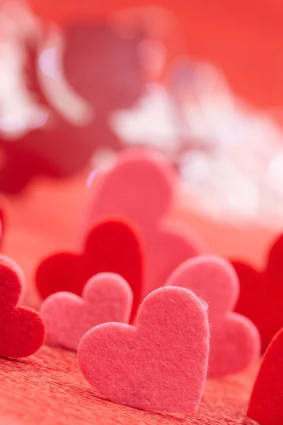 Hearts on red background — Stock Photo, Image