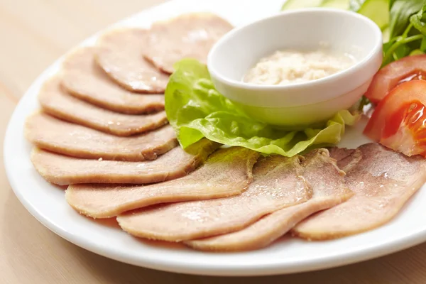 Slices of boiled beef tongue — Stock Photo, Image