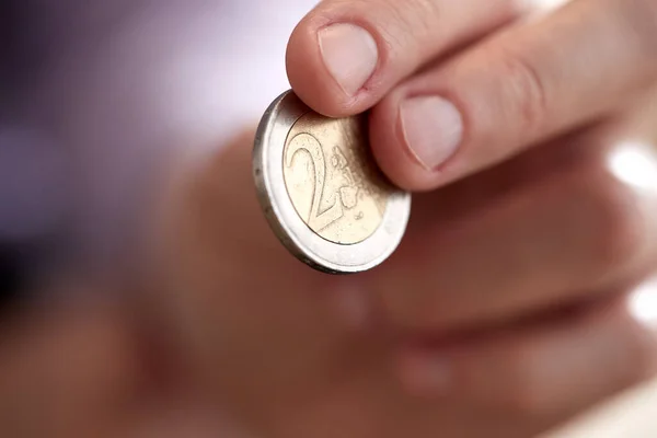 Closeup Man Hand Holding Coin Isolated White Background — Stockfoto