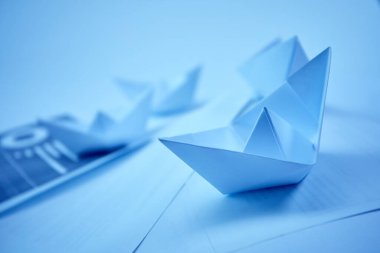 business concept, paper boats on the documents