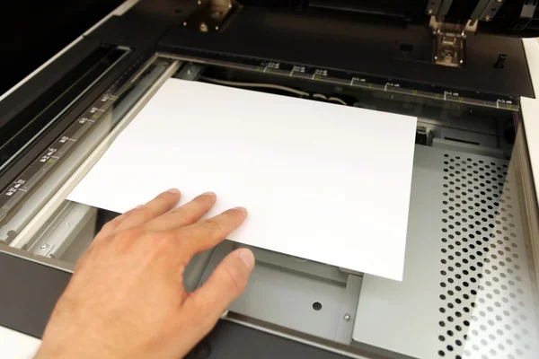 A person handling with working laser copier — Stock Photo, Image