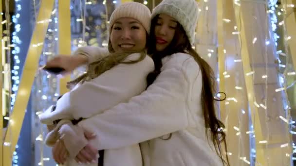 Two Girlfriends Asian Girls White Coats Having Fun Hugging New — Stock Video