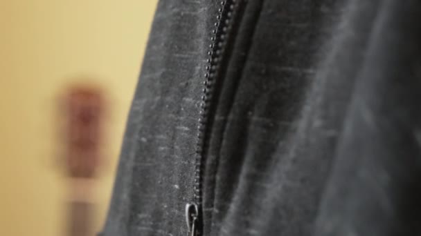 Close Man Zipping His Hoodie Jacket — Stock Video