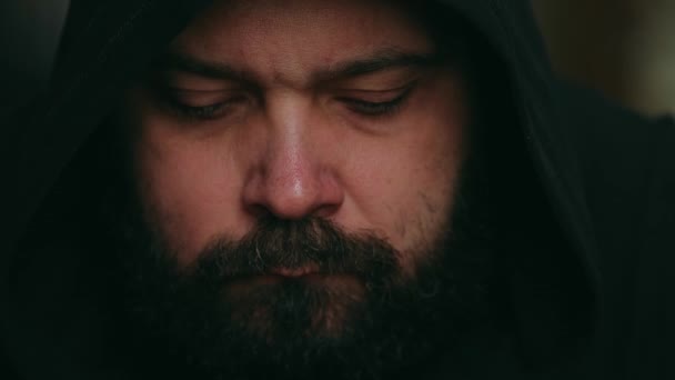 Man Beard Hood Looks Sadly Camera Static Camera Close Face — Stock Video