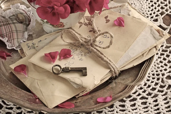 Vintage background of old mail with keys on a silver plate — Stock Photo, Image