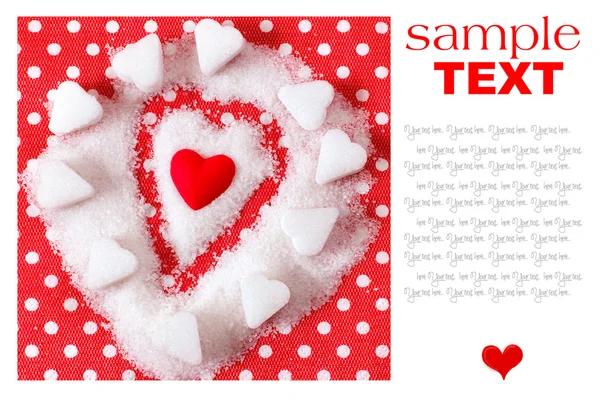 Serce w cukier na czerwonym tle. symbol Walentynki — Zdjęcie stockowe