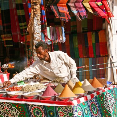 Egyptian man selling spice in Aswan Egypt on May 05 2008. Egypt's total agricultural crop production has increased by more than 20 percent in the past decade. clipart