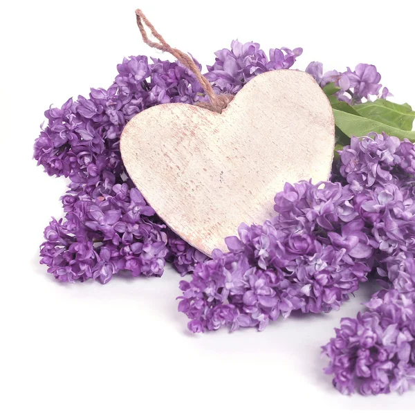 Beautiful Bunch of Lilac with wooden heart — Stock Photo, Image