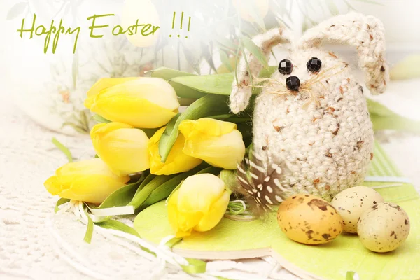 Easter bunny, eggs and tulips — Stock Photo, Image